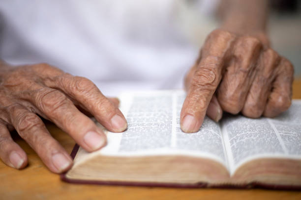 istock Old man reading The holy  bible 1210789990