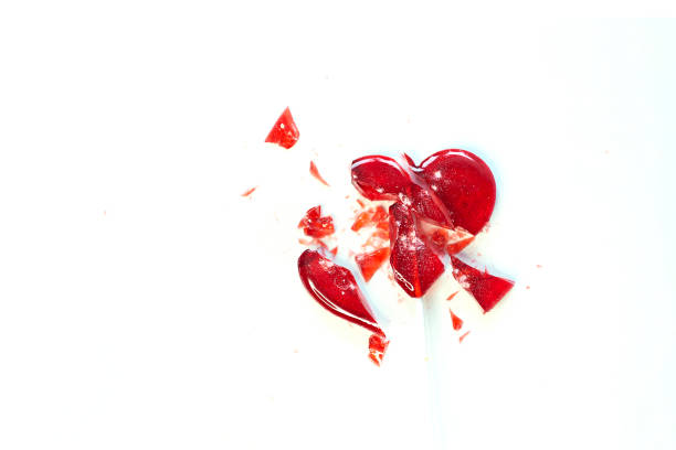 broken heart red lollipop sweet isolated on white background.