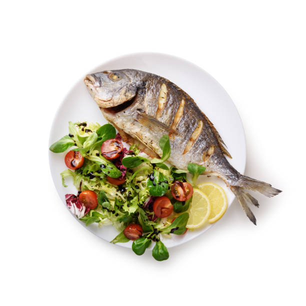 istock Grilled dorada fish on white plate 1210791263
