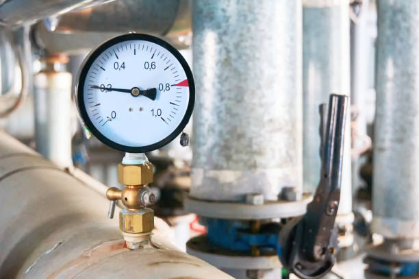 Pressure gauge showing pressure on the water supply pipe. Pressure gauge showing pressure supply conduit. pressure sensor stock pictures, royalty-free photos & images