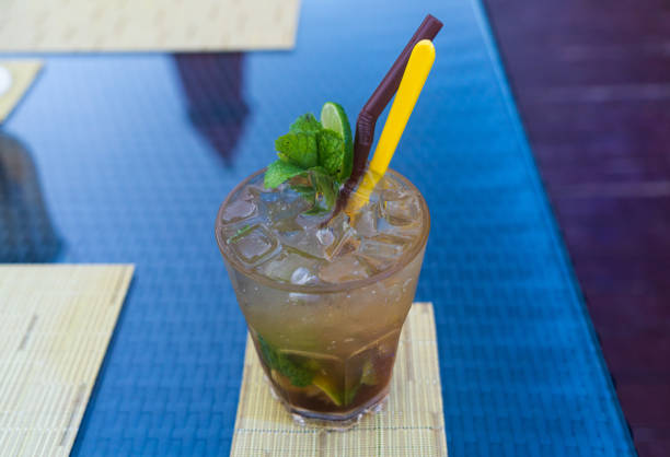 Summer mojito cocktail on the pool table
