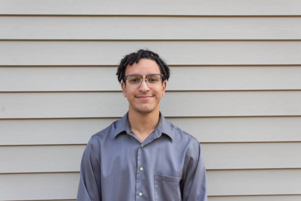 istock Smiling handsome young biracial man, millennial with dreadlocks 1210794947