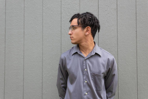 istock Strong and serious young black man in profile over a neutral background, natural dreadlock hairstyle, powerful mixed race male 1210794949