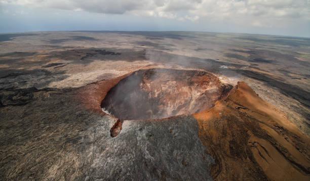 Aerial view of the crater of the Mauna Loa volcano on Big Island, Hawaii The smoking crater of the volcano Mauna Loa on Big Island, Hawaiian archipelago, in Volcanoes National Park, after the eruption of lava in the summer of 2018, from the air active volcano photos stock pictures, royalty-free photos & images