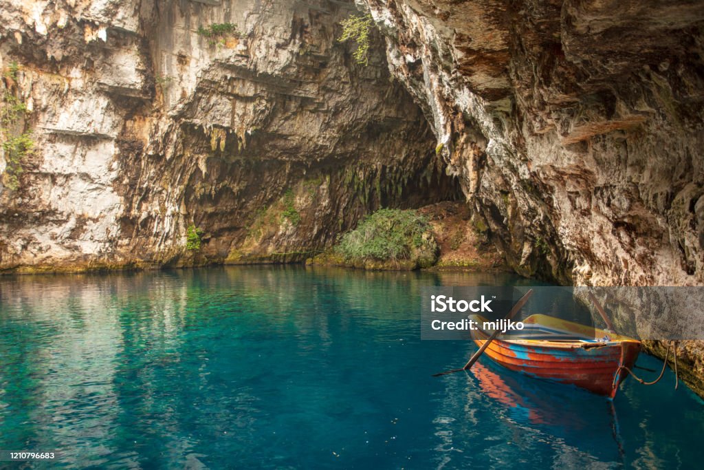 Melissani cave and lake Melissani lake and cave is located near Sami, small town and port on Kefalonia island. Many tourists visiting this place all over the year. Kefalonia Stock Photo