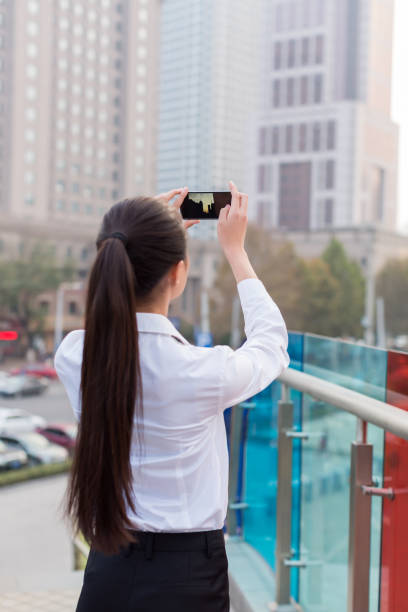 istock girl using a mobile phone, business women 1210797041