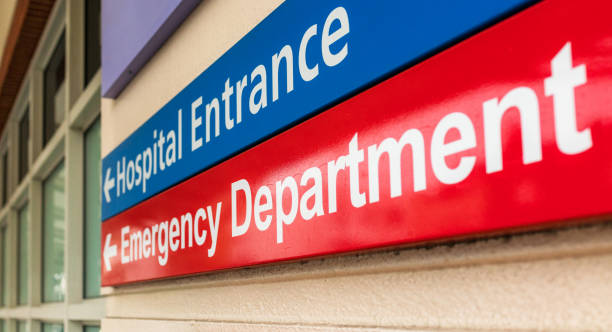 Hospital Emergency Department sign A hospital sign in London, giving directions towards the emergency department. emergency room stock pictures, royalty-free photos & images