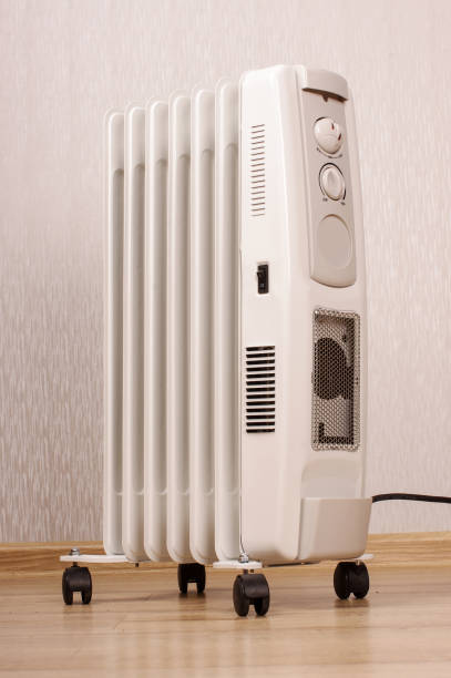 istock Oil-filled electrical radiator for additional home heating 1210804123