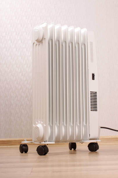 istock Oil-filled electrical radiator for additional home heating 1210804659