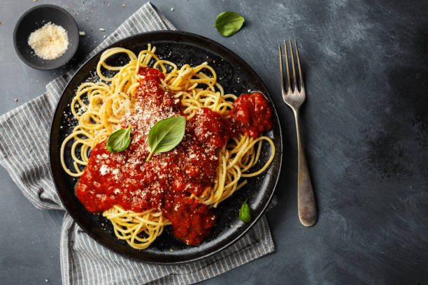 Pasta with tomato sauce on plate stock photo