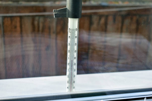 istock Thermometer on the balcony behind the glass 1210806496