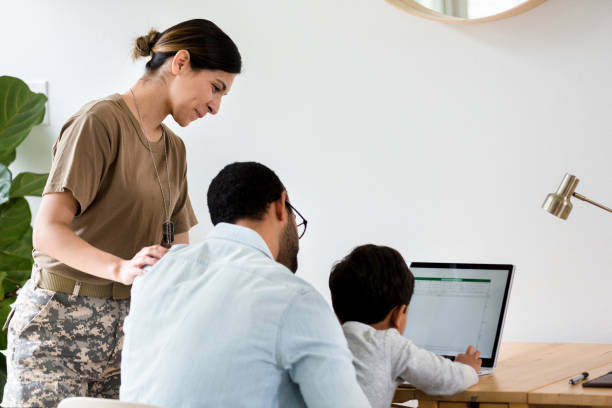 istock Little boy learns to use laptop 1210807258