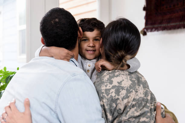 istock Excited boy hugs his parents 1210807281