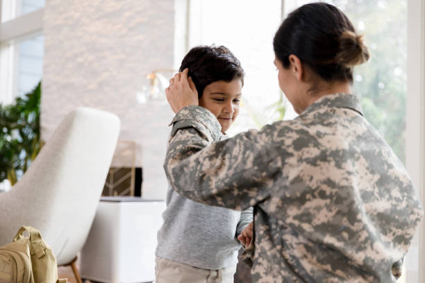 istock Female soldier has special moment with young son 1210807295