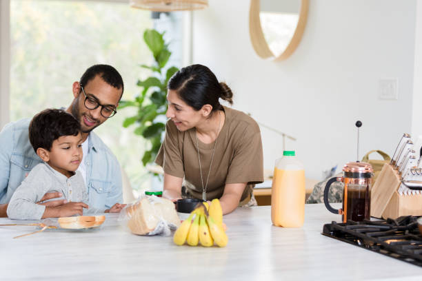 istock Parents smile as son decides what to eat for lunch 1210807962