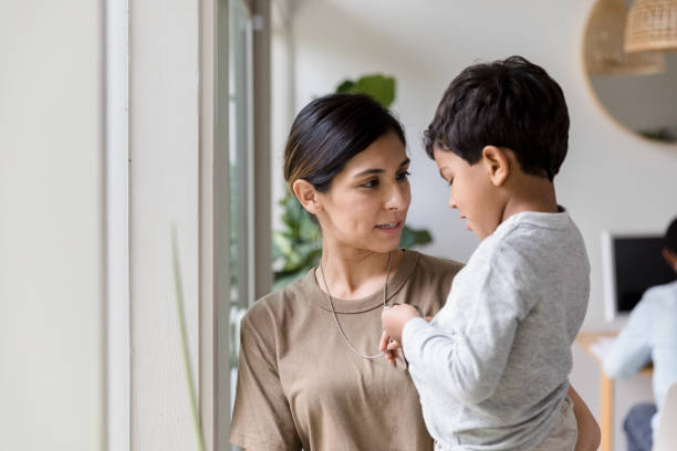 istock While father works, mother and son have serious conversation 1210807997