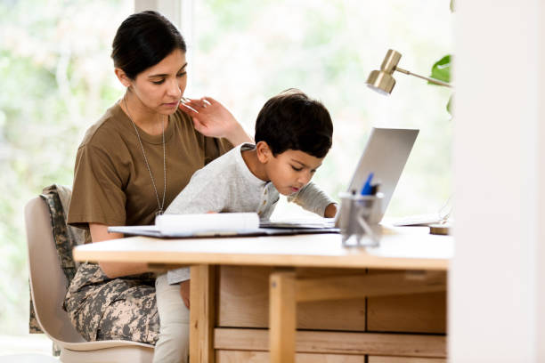 istock Preschool age boy uses laptop with his mom 1210808094