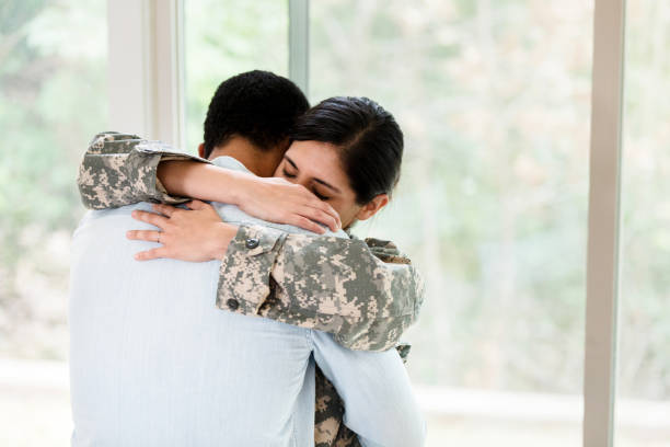 istock Female soldier is sad to leave husband 1210808098