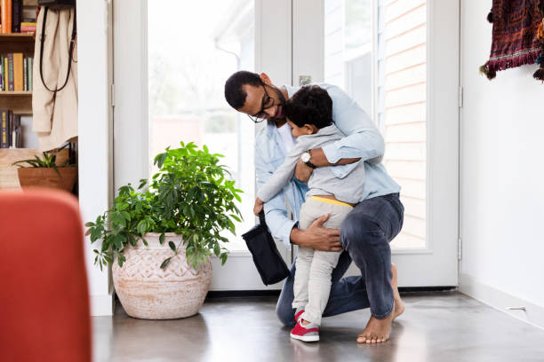 istock Happy dad gives his son a hug 1210808135