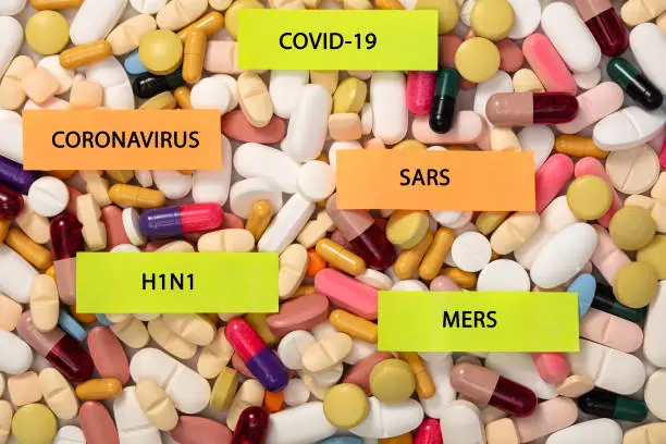Close-up multi-colored pills and tablets background with sticky notes, full frame