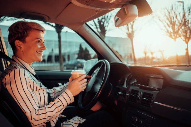 istock Smiling woman in a car 1210810024