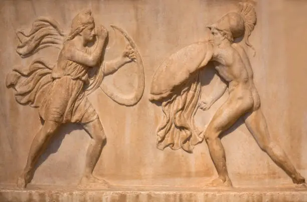 Ancient Greek bas-relief on funerary stele depicting an Amazonomachy - mythical battles between the Ancient Greeks and the Amazons, a nation of female warriors.