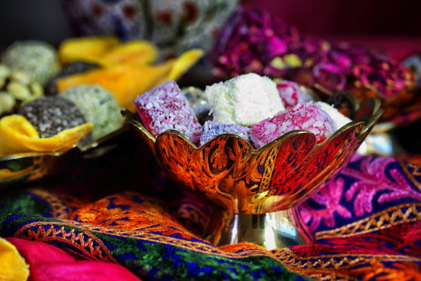istock Oriental sweets on a red background in copper utensils 1210815837
