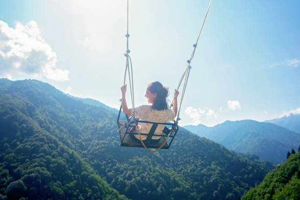istock Female on Swing in the mountains. 1210816035