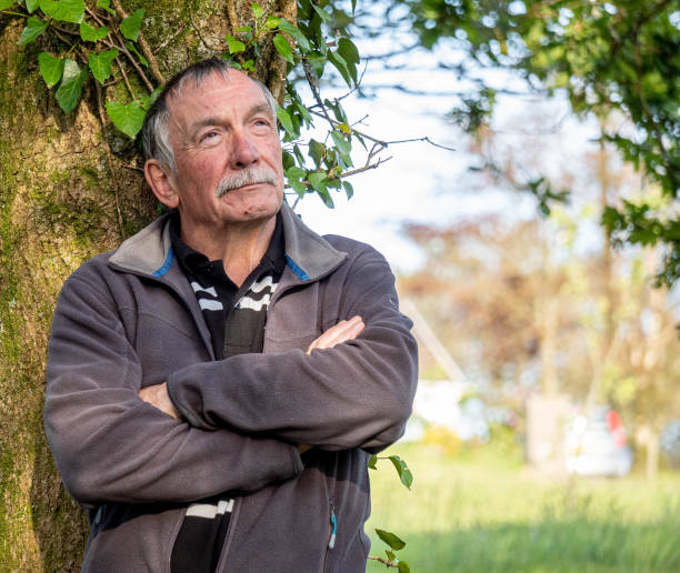 istock senior man relaxing in rural setting 1210816933
