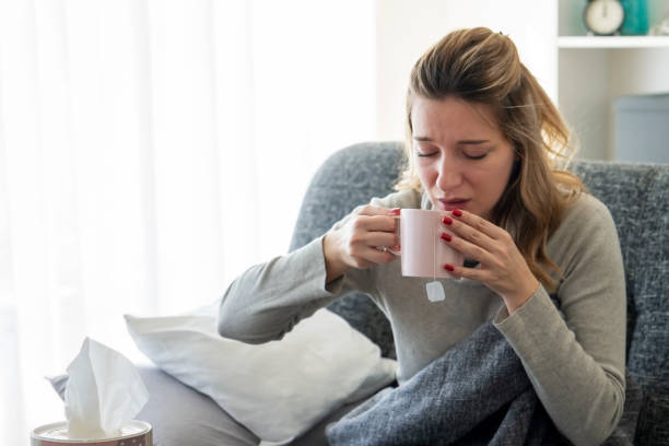 istock Sick woman with flu at home 1210818672