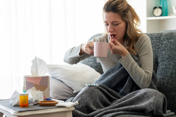 istock Sick woman with flu at home 1210818685