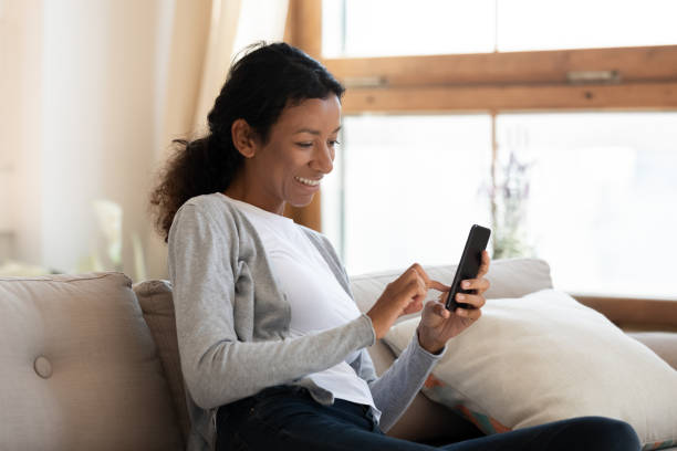 istock Smiling biracial woman take selfie on smartphone gadget 1210820224
