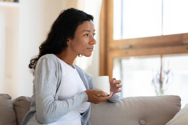 istock Dreamy biracial woman look in distance thinking or visualizing 1210820241
