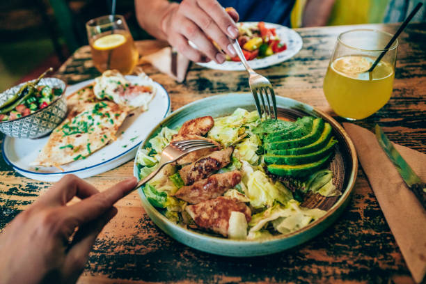 istock Couple eating healthy dinner at restaurant 1210820339