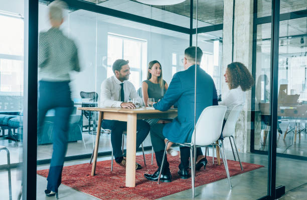 istock Team of professionals during a meeting. 1210820374