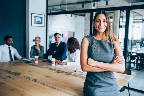 istock Businesswoman and her team. 1210820389
