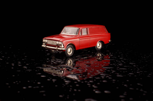 istock Red USSR car die-cast model on the black reflective background 1210821625