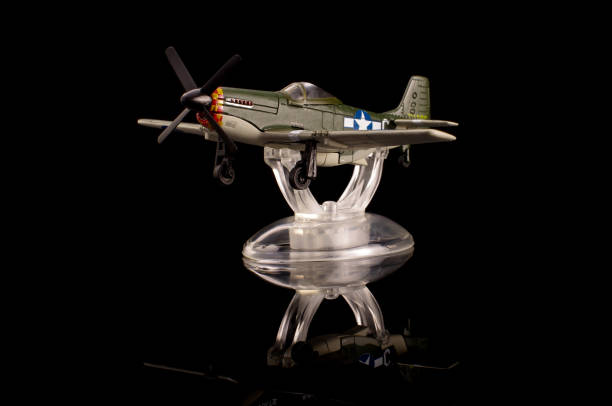 istock WWII die cast model plane isolated on the black background 1210821658