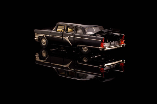 istock Black USSR car die-cast model on the black reflective background 1210821724