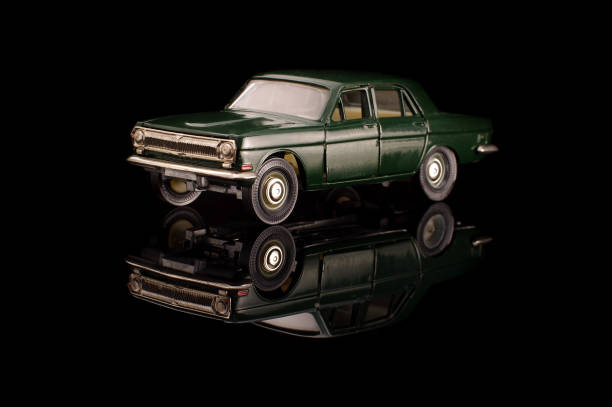 istock Green USSR car die-cast model on the black reflective background 1210821727