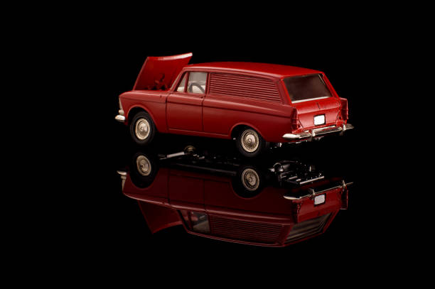 istock Red USSR car die-cast model on the black reflective background 1210821738