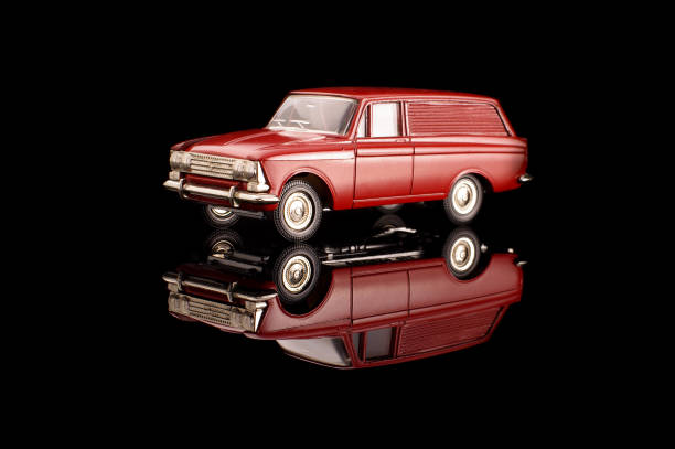Red USSR car die-cast model on the black reflective background