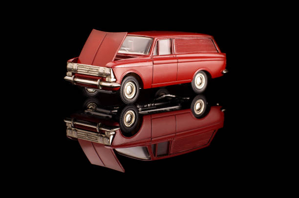istock Red USSR car die-cast model on the black reflective background 1210821749