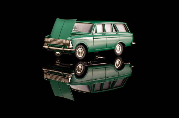 istock Green USSR car die-cast model on the black reflective background 1210821787