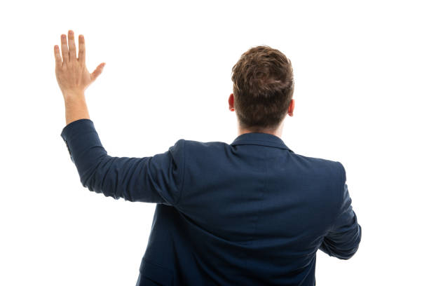 istock Back view of man wearing smart casual clothes taking oath 1210824359