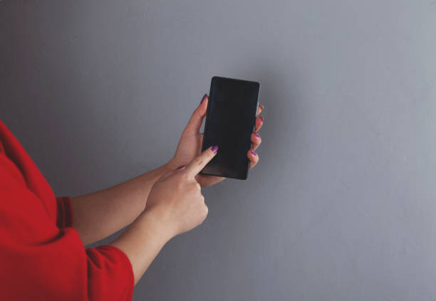 istock woman hand smart phone 1210824710