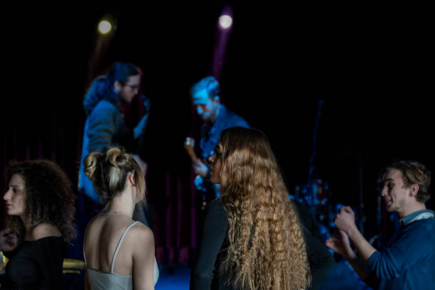 istock Young people having fun in at a concerts 1210825986