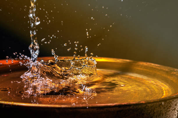 istock A stream of water flows into the copper wash basin 1210826999