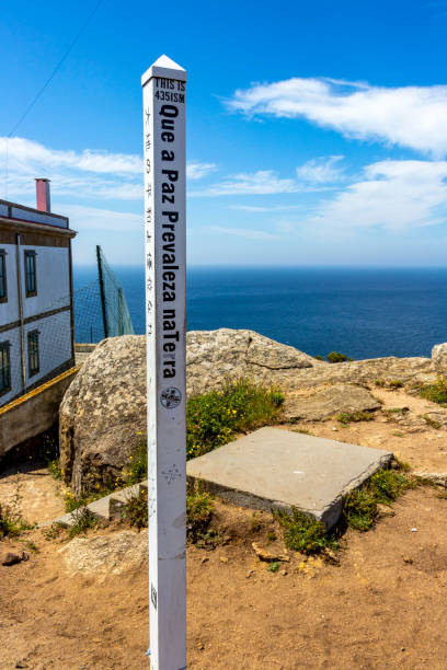Fisterra, Spain - June 14, 2017: A Peace Pole in Galician language at Cape Finisterre, Cabo Fisterra or Cabo Finisterre - the end of the Way of St. James