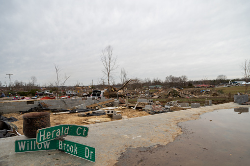 A street sign marks sits in a driveway following a deadly tornado Wednesday, March 3, 2020, in Cookeville, Tennessee. Tornadoes ripped across Tennessee early Tuesday, damaging buildings and killing multiple people.